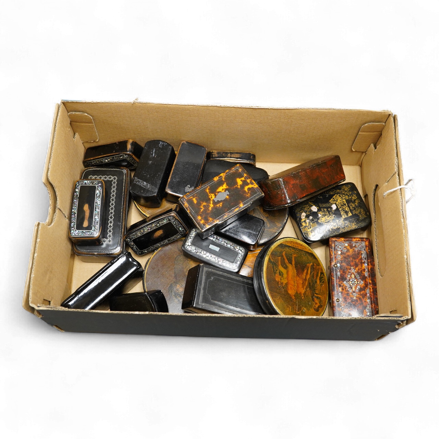 A collection of various snuff boxes to include papier mache examples, two with printed lids and some inlaid examples